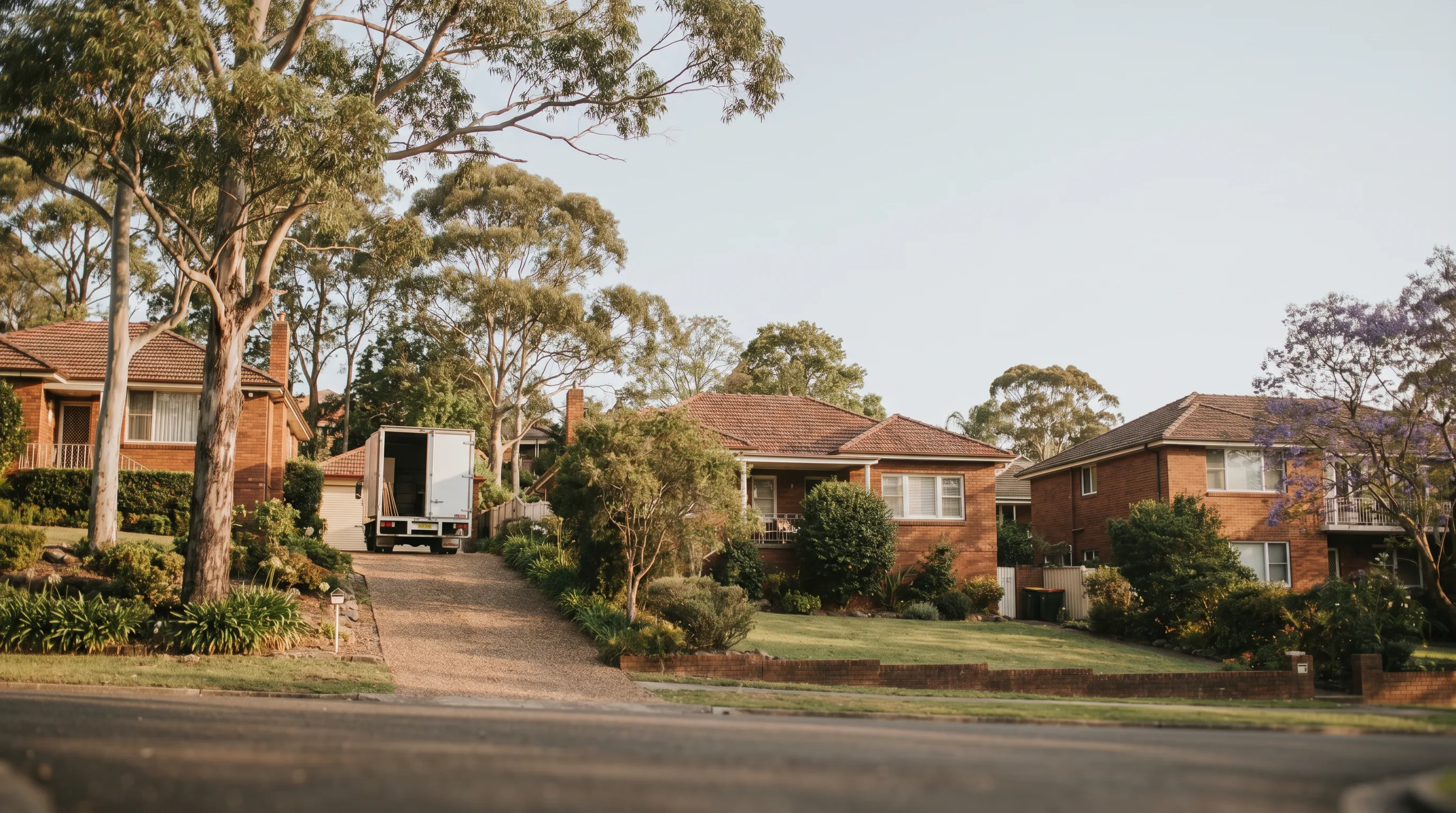 A street in Denistone, Northern Districts, with a removal truck